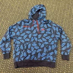 Nike Black Hoodie with Blue All-Over Logo and Red Drawcord